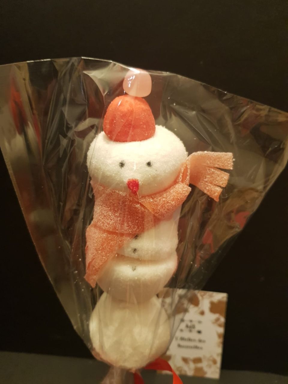 Brochette de bonbons Bonhomme de neige chapeau rouge